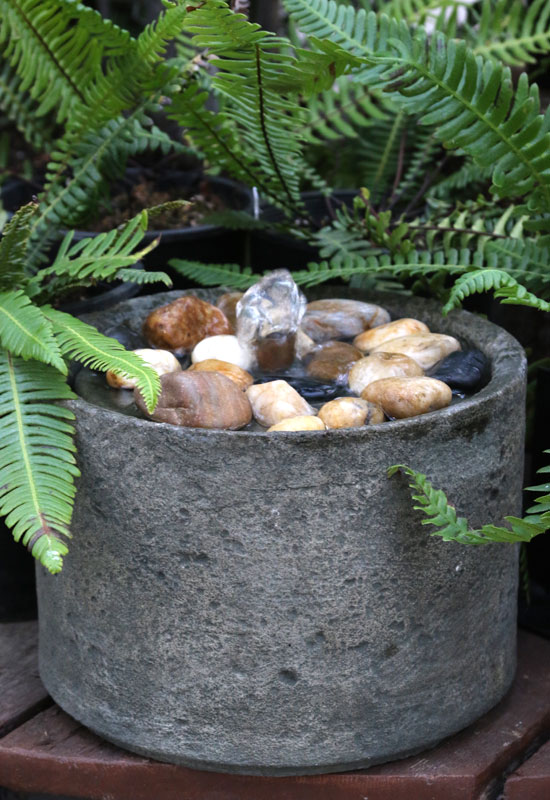 tabletop fountain with deer ferns